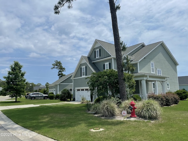 8395 Penny Royal Ln, Wilmington, NC 28412 - view of front of house featuring board and batten siding, a front yard, an attached garage, and covered porch