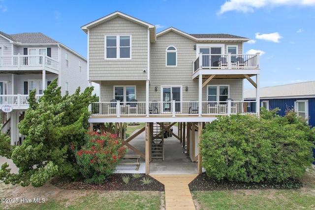 1116 E Beach Dr, Oak Island, NC 28465 - view of front of home featuring stairs