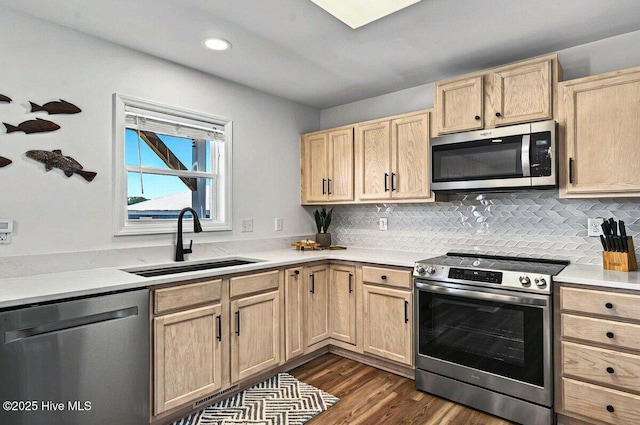 1116 E Beach Dr, Oak Island, NC 28465 - kitchen featuring stainless steel appliances, light brown cabinets, light countertops, dark wood-type flooring, and recessed lighting