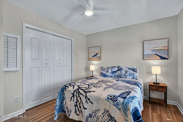 1116 E Beach Dr, Oak Island, NC 28465 - bedroom with wood finished floors, a closet, and ceiling fan