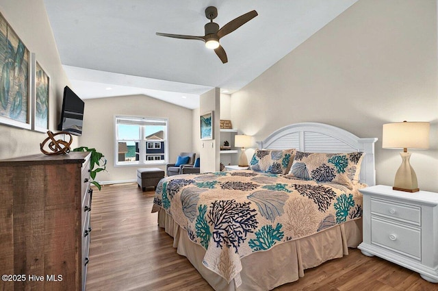 1116 E Beach Dr, Oak Island, NC 28465 - bedroom with lofted ceiling, wood finished floors, and ceiling fan