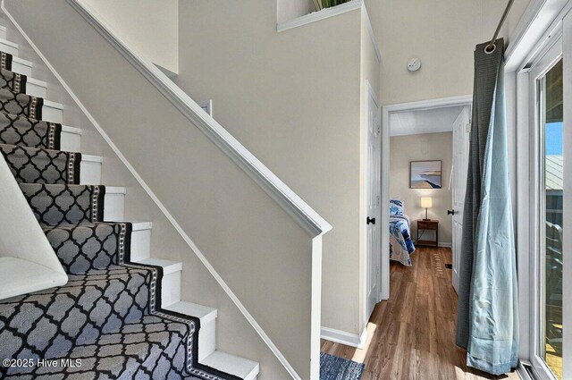 1116 E Beach Dr, Oak Island, NC 28465 - stairway featuring wood finished floors and baseboards