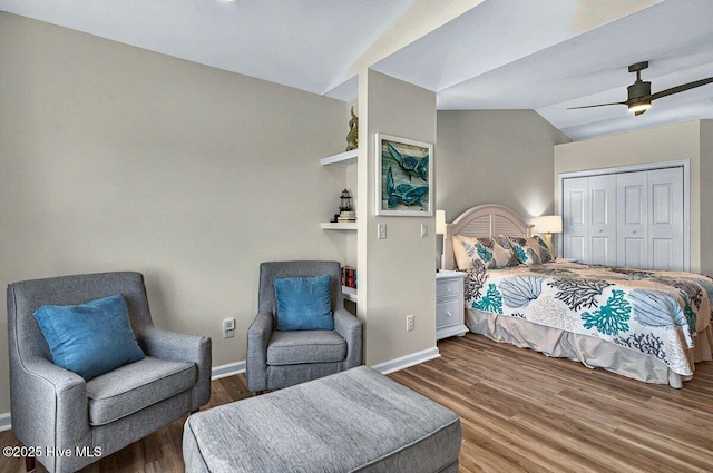 1116 E Beach Dr, Oak Island, NC 28465 - bedroom featuring vaulted ceiling, wood finished floors, baseboards, a closet, and a ceiling fan