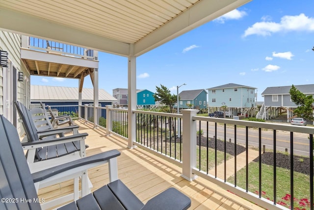 1116 E Beach Dr, Oak Island, NC 28465 - wooden terrace with a residential view
