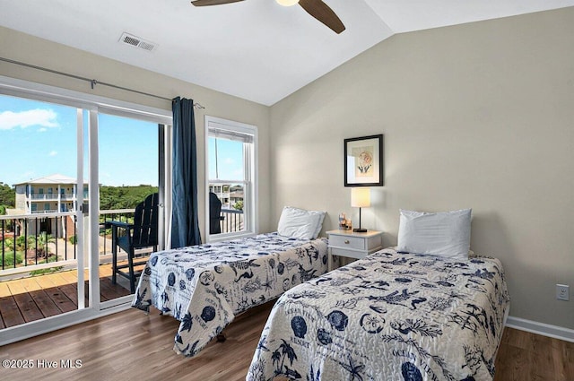 1116 E Beach Dr, Oak Island, NC 28465 - bedroom with vaulted ceiling, access to outside, wood finished floors, and ceiling fan