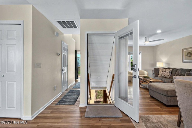 1116 E Beach Dr, Oak Island, NC 28465 - entryway featuring french doors, healthy amount of natural light, and wood finished floors