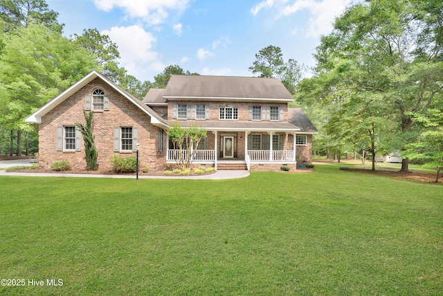 109 Country Club Dr, Rockingham, NC 28379 - view of front of house with brick siding, a porch, and a front lawn