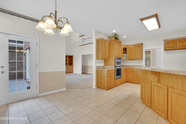 109 Country Club Dr, Rockingham, NC 28379 - kitchen with double oven, light countertops, a chandelier, glass insert cabinets, and recessed lighting