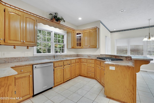 109 Country Club Dr, Rockingham, NC 28379 - kitchen with stainless steel appliances, a peninsula, a sink, light tile patterned floors, and light countertops
