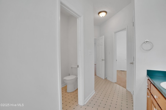 109 Country Club Dr, Rockingham, NC 28379 - bathroom featuring vanity, toilet, tile patterned floors, and baseboards