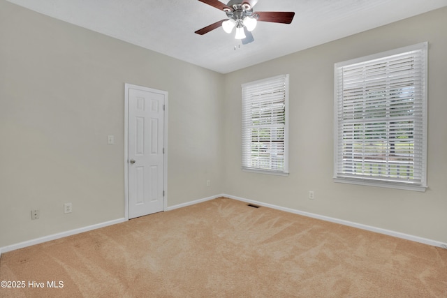 109 Country Club Dr, Rockingham, NC 28379 - unfurnished room with carpet floors, baseboards, ceiling fan, and healthy amount of natural light