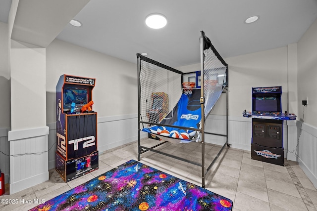 4248 Island Dr, North Topsail Beach, NC 28460 - playroom featuring a wainscoted wall, recessed lighting, and tile patterned flooring