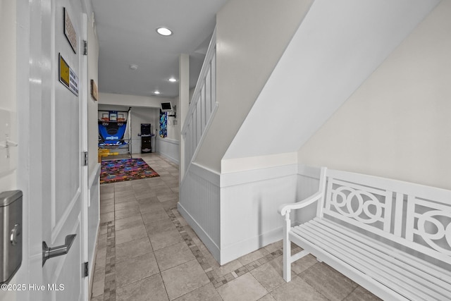 4248 Island Dr, North Topsail Beach, NC 28460 - foyer entrance with wainscoting, recessed lighting, and stairs