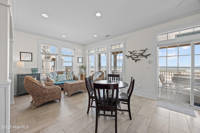4248 Island Dr, North Topsail Beach, NC 28460 - dining area with ornamental molding, recessed lighting, and baseboards