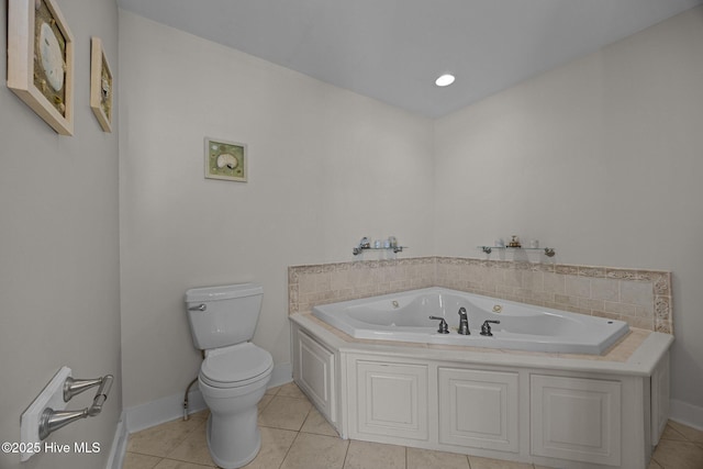 4248 Island Dr, North Topsail Beach, NC 28460 - bathroom with toilet, baseboards, a garden tub, and tile patterned flooring
