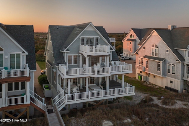 4248 Island Dr, North Topsail Beach, NC 28460 - back of property featuring a balcony and roof with shingles