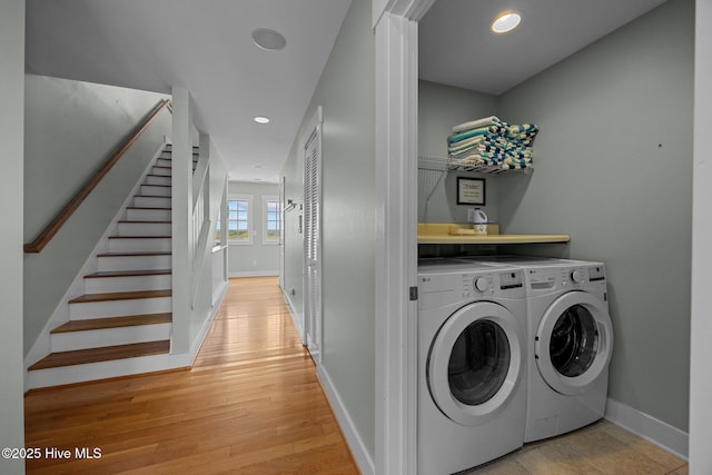 4248 Island Dr, North Topsail Beach, NC 28460 - laundry area featuring washing machine and dryer, light wood-style floors, baseboards, and recessed lighting
