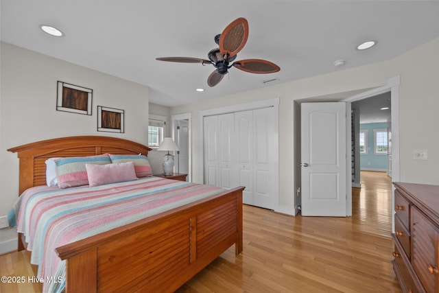 4248 Island Dr, North Topsail Beach, NC 28460 - bedroom with light wood-style flooring, baseboards, a closet, and recessed lighting