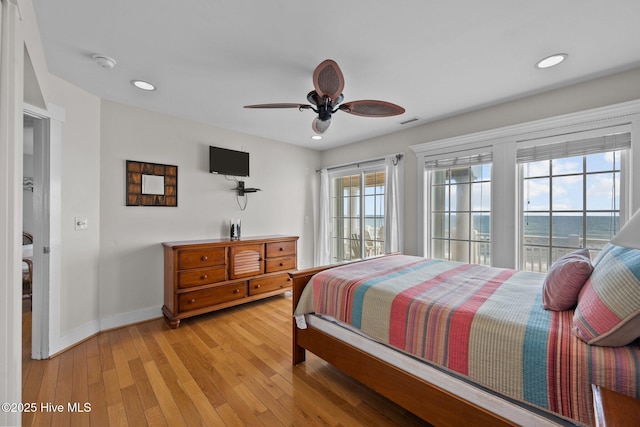 4248 Island Dr, North Topsail Beach, NC 28460 - bedroom with baseboards, light wood-type flooring, recessed lighting, and ceiling fan