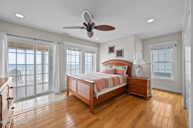 4248 Island Dr, North Topsail Beach, NC 28460 - bedroom with access to exterior, light wood-style flooring, baseboards, and recessed lighting