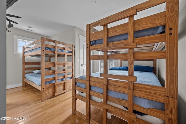 4248 Island Dr, North Topsail Beach, NC 28460 - bedroom with wood finished floors and baseboards