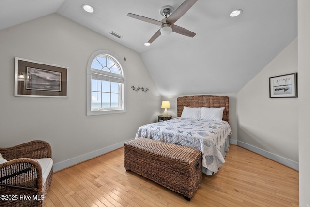 4248 Island Dr, North Topsail Beach, NC 28460 - bedroom with vaulted ceiling, baseboards, hardwood / wood-style floors, a ceiling fan, and recessed lighting