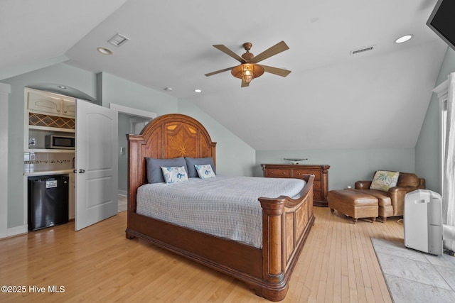 4248 Island Dr, North Topsail Beach, NC 28460 - bedroom featuring vaulted ceiling, light wood finished floors, and ceiling fan