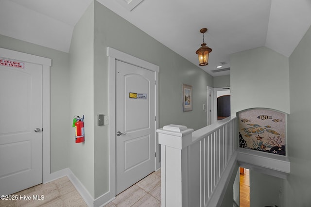 4248 Island Dr, North Topsail Beach, NC 28460 - hallway featuring an upstairs landing, baseboards, and lofted ceiling