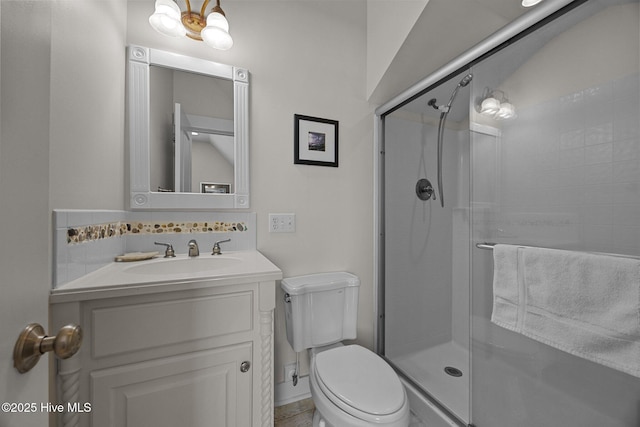 4248 Island Dr, North Topsail Beach, NC 28460 - full bath with toilet, a stall shower, vanity, backsplash, and baseboards
