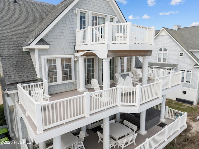 4248 Island Dr, North Topsail Beach, NC 28460 - back of house with roof with shingles, outdoor dining area, and a deck