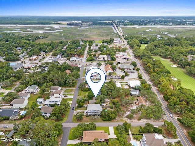 302 Mcglamery St, Oak Island, NC 28465 - aerial view of property and surrounding area with a tree filled landscape