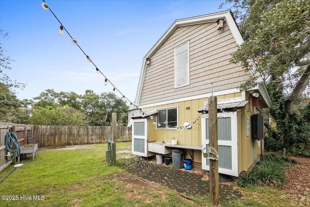 302 Mcglamery St, Oak Island, NC 28465 - rear view of property with board and batten siding