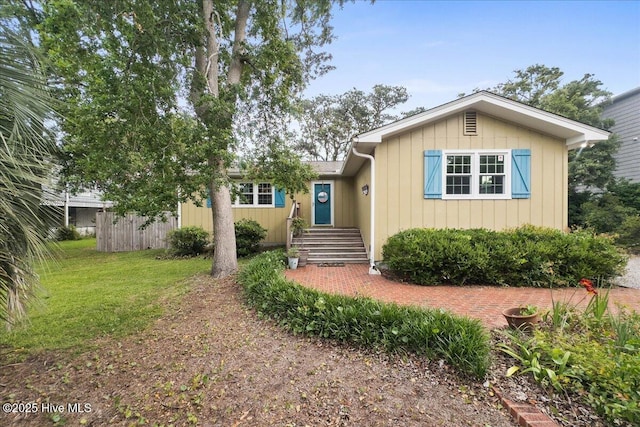 302 Mcglamery St, Oak Island, NC 28465 - view of front of home with board and batten siding