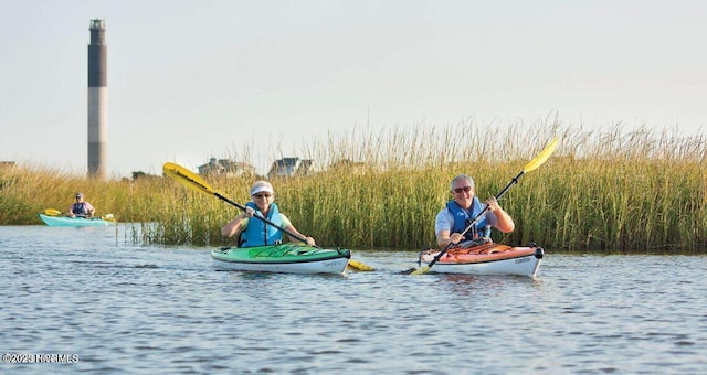 302 Mcglamery St, Oak Island, NC 28465 - surrounding community with a water view