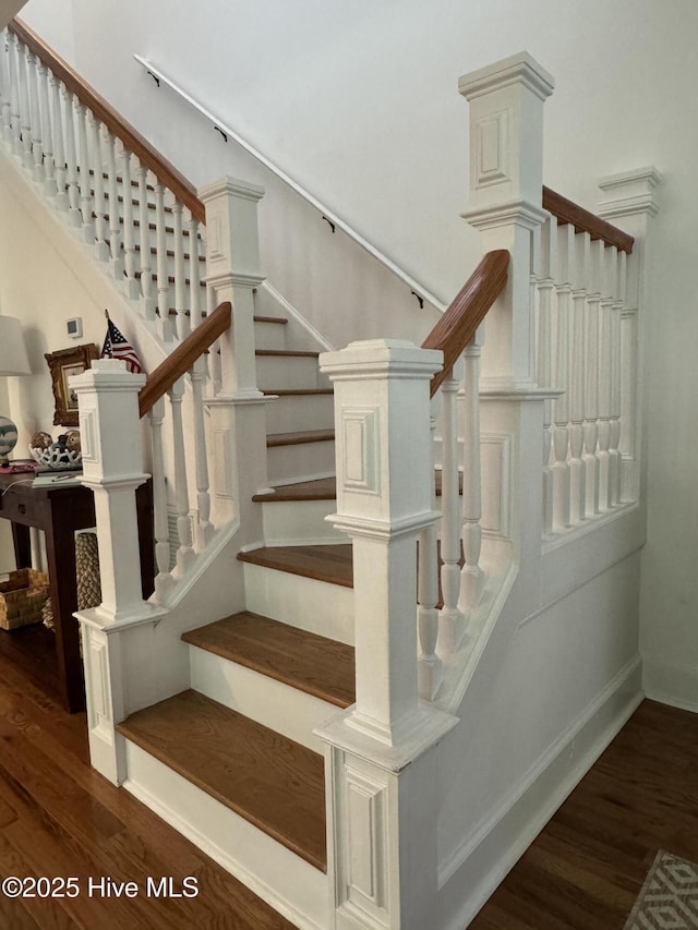 19 Sabal Palm Trl, Bald Head Island, NC 28461 - staircase featuring wood finished floors and baseboards