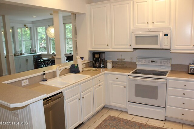 19 Sabal Palm Trl, Bald Head Island, NC 28461 - kitchen with dishwasher, open floor plan, light countertops, white cabinets, and a ceiling fan
