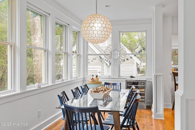 19 Sabal Palm Trl, Bald Head Island, NC 28461 - dining space featuring wine cooler and light wood-type flooring