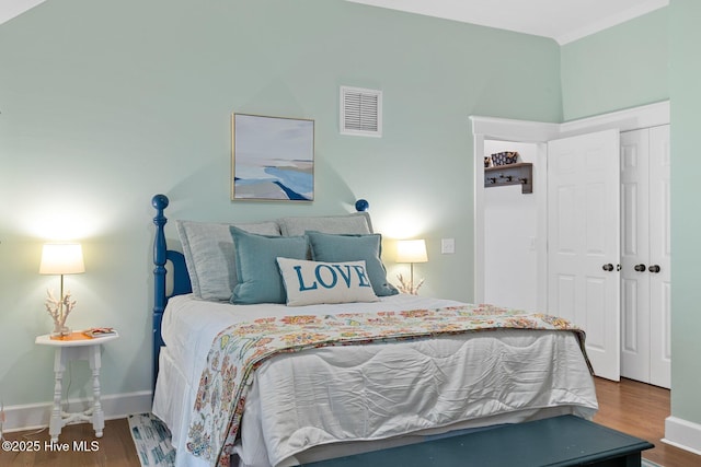 19 Sabal Palm Trl, Bald Head Island, NC 28461 - bedroom with wood finished floors and a closet