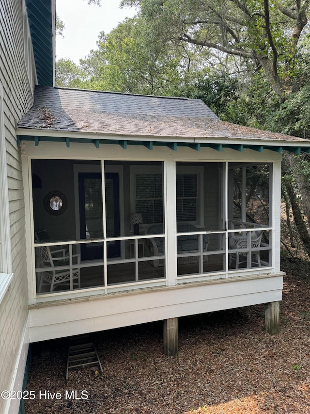 19 Sabal Palm Trl, Bald Head Island, NC 28461 - rear view of property featuring roof with shingles