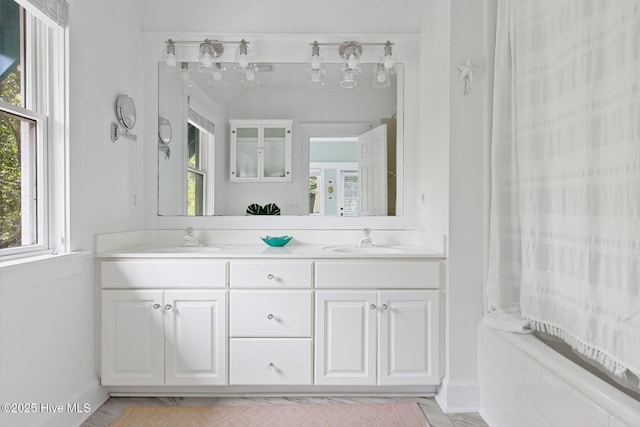 19 Sabal Palm Trl, Bald Head Island, NC 28461 - full bath featuring healthy amount of natural light, double vanity, and baseboards