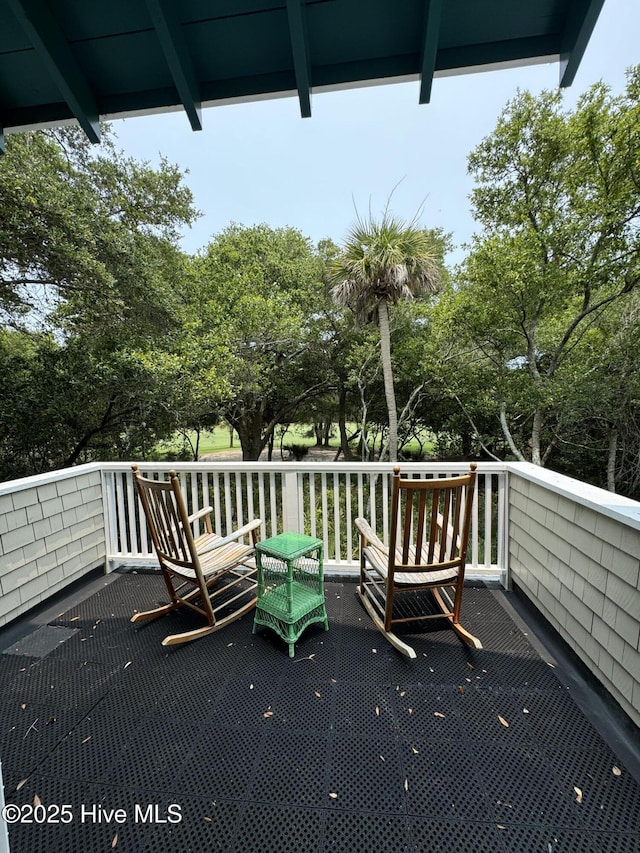 19 Sabal Palm Trl, Bald Head Island, NC 28461 - wooden terrace with view of scattered trees