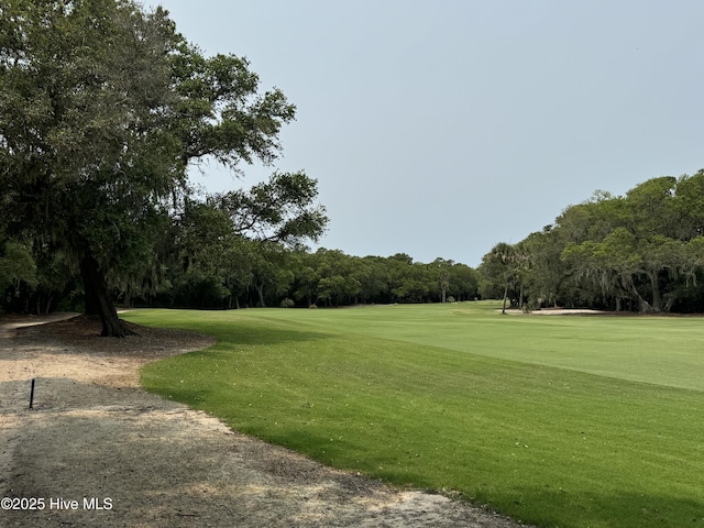 19 Sabal Palm Trl, Bald Head Island, NC 28461 - view of home's community featuring a yard, view of golf course, and view of scattered trees