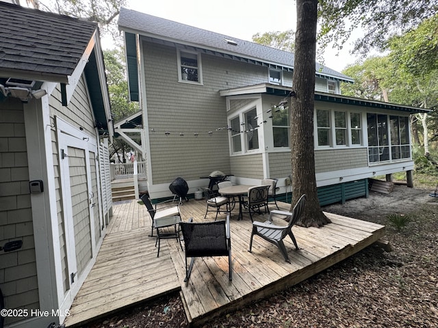 19 Sabal Palm Trl, Bald Head Island, NC 28461 - wooden deck with a sunroom