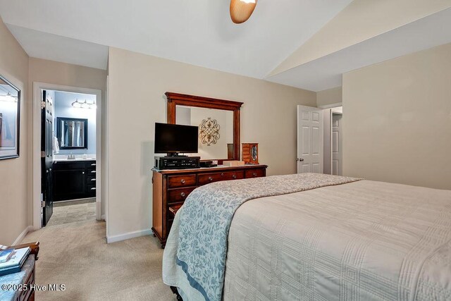 235 Chambers St, Winnabow, NC 28479 - bedroom featuring light carpet, lofted ceiling, baseboards, and a sink