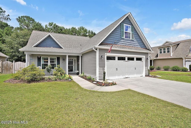235 Chambers St, Winnabow, NC 28479 - view of front facade featuring a garage, driveway, a shingled roof, and covered porch