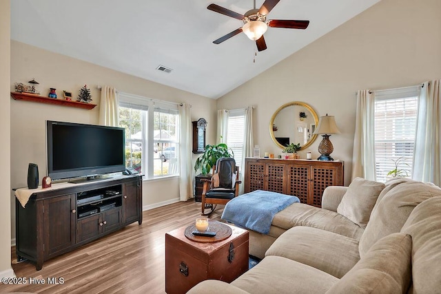 235 Chambers St, Winnabow, NC 28479 - living room featuring a ceiling fan, light wood-style flooring, baseboards, and high vaulted ceiling