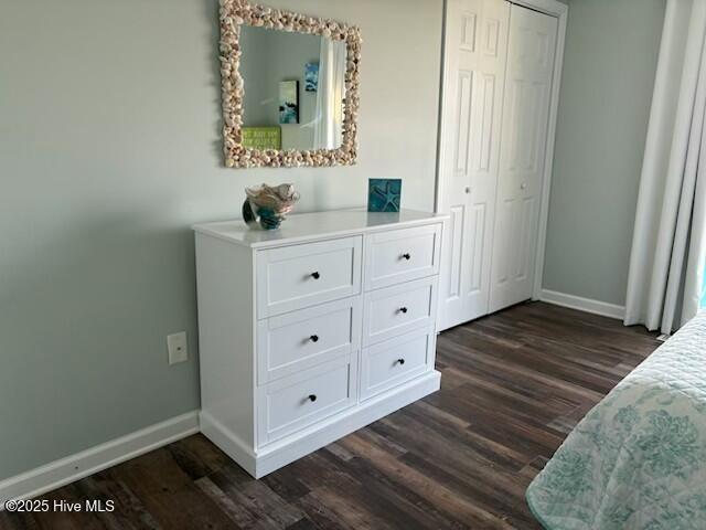 1116 E Ft Macon Rd, Atlantic Beach, NC 28512 - bedroom featuring dark wood finished floors, baseboards, and a closet