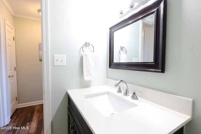 1116 E Ft Macon Rd, Atlantic Beach, NC 28512 - bathroom with vanity, crown molding, and wood finished floors