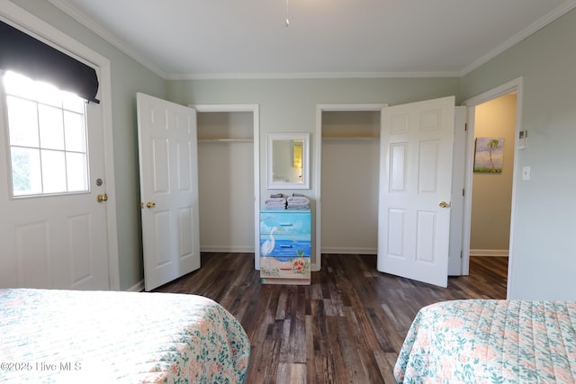 1116 E Ft Macon Rd, Atlantic Beach, NC 28512 - bedroom featuring multiple closets, ornamental molding, dark wood-type flooring, and baseboards