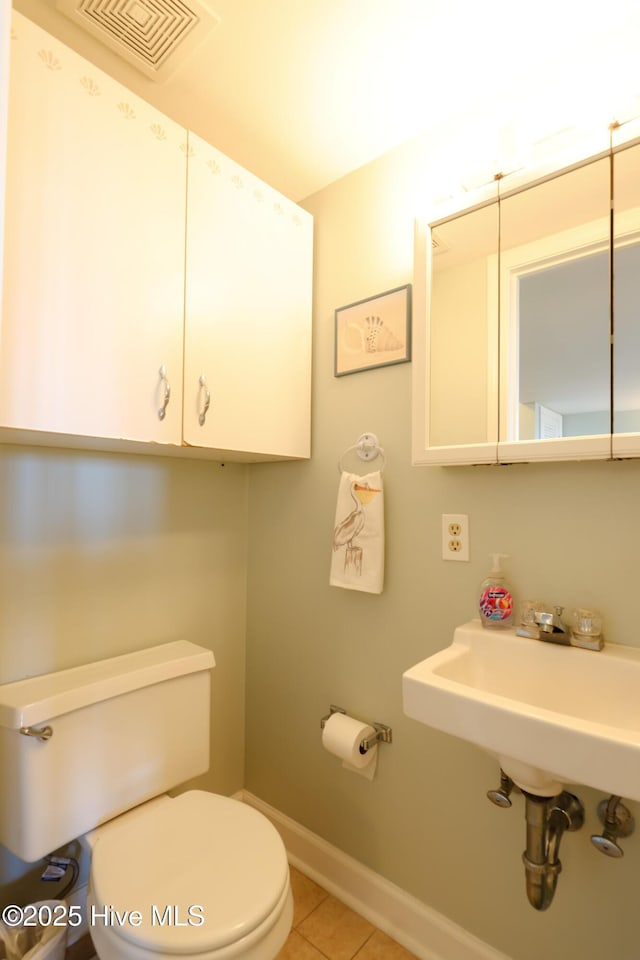 1116 E Ft Macon Rd, Atlantic Beach, NC 28512 - half bath featuring toilet, tile patterned flooring, and baseboards
